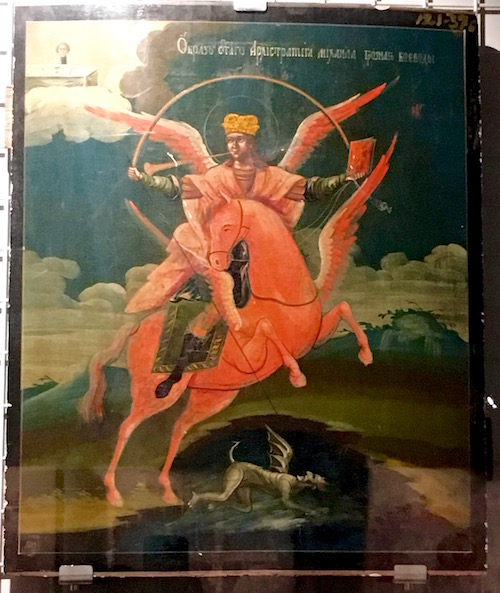 Some wild version of St. George? Or an archangel snuffing out a demon? Russian saint?